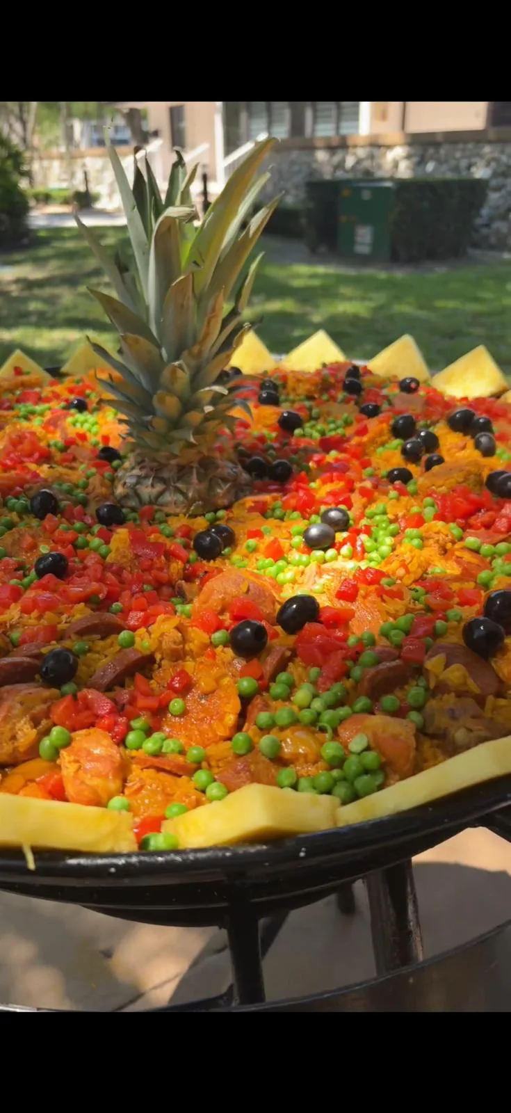 Hermanos Fuego chef cooking Spanish paella live at a Miami event